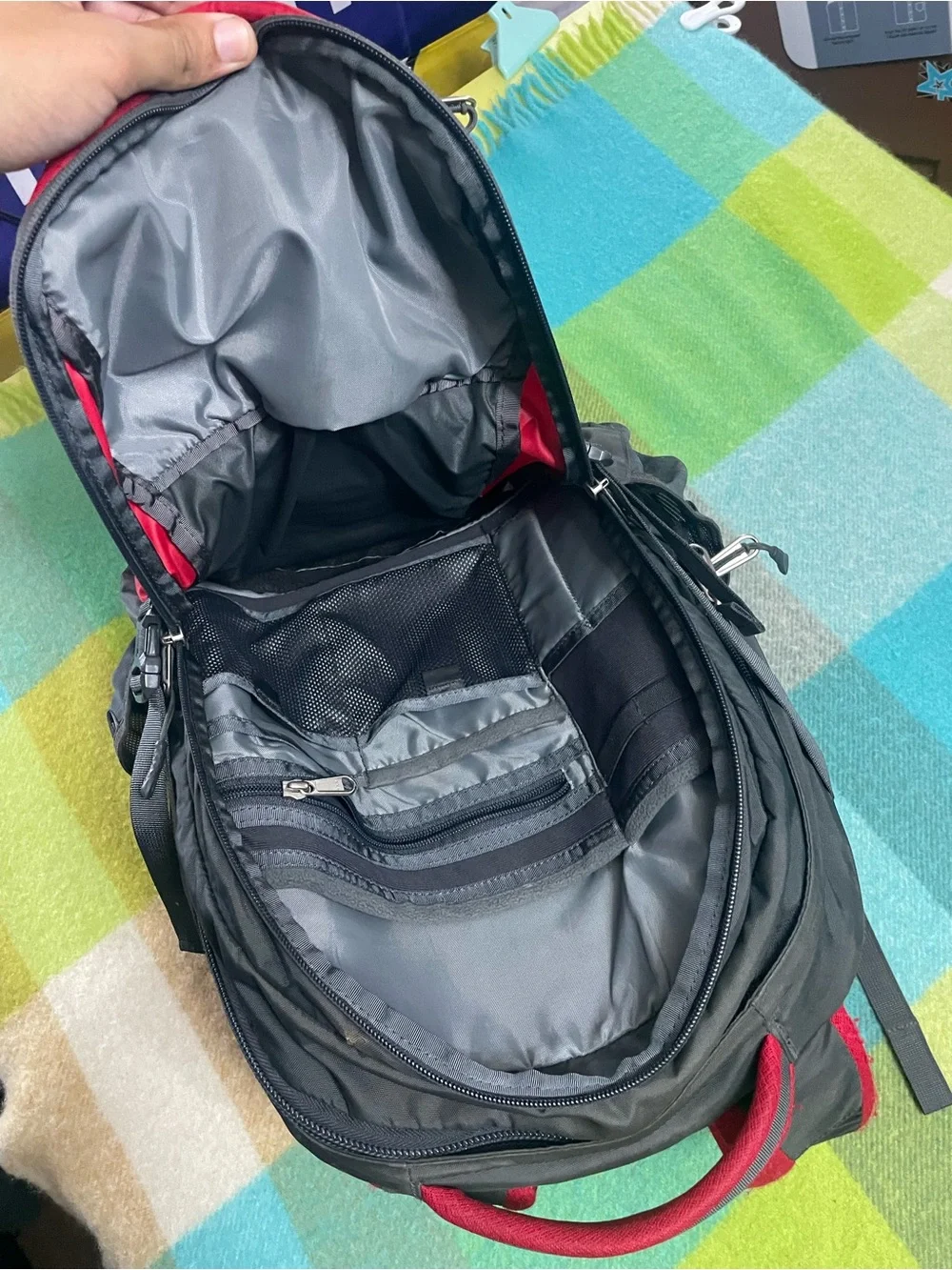 The North Face Recon backpack in charcoal gray and bright red